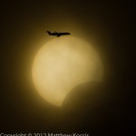 An aircraft flies through the May 20th Solar Eclipse